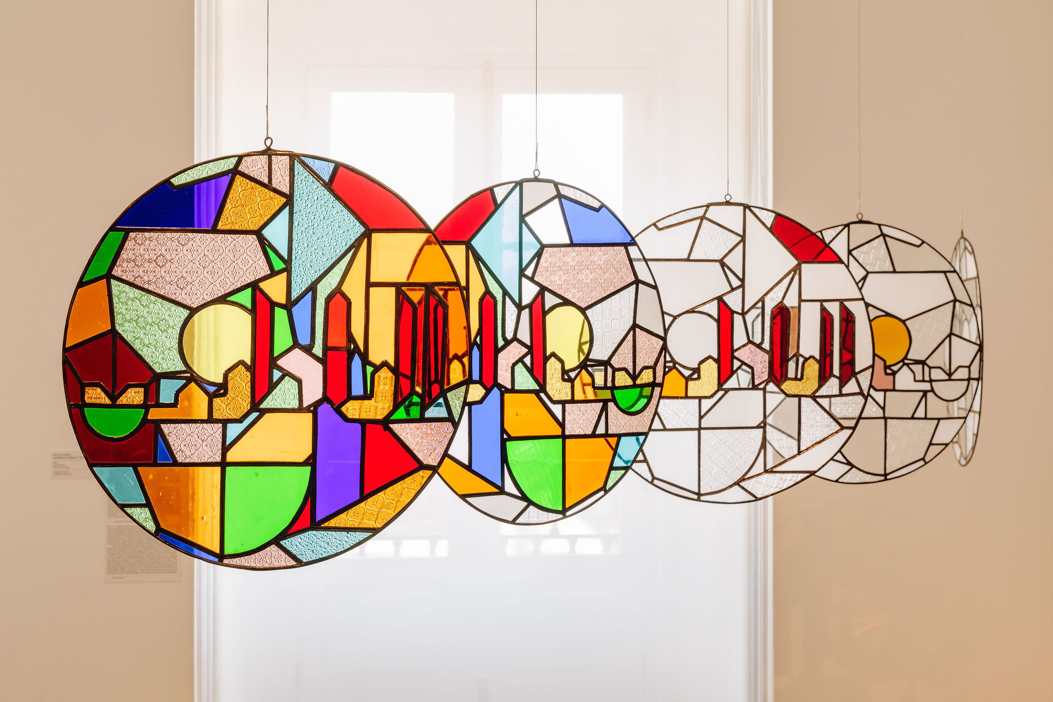 Stained glass artwork with colourful abstract shapes